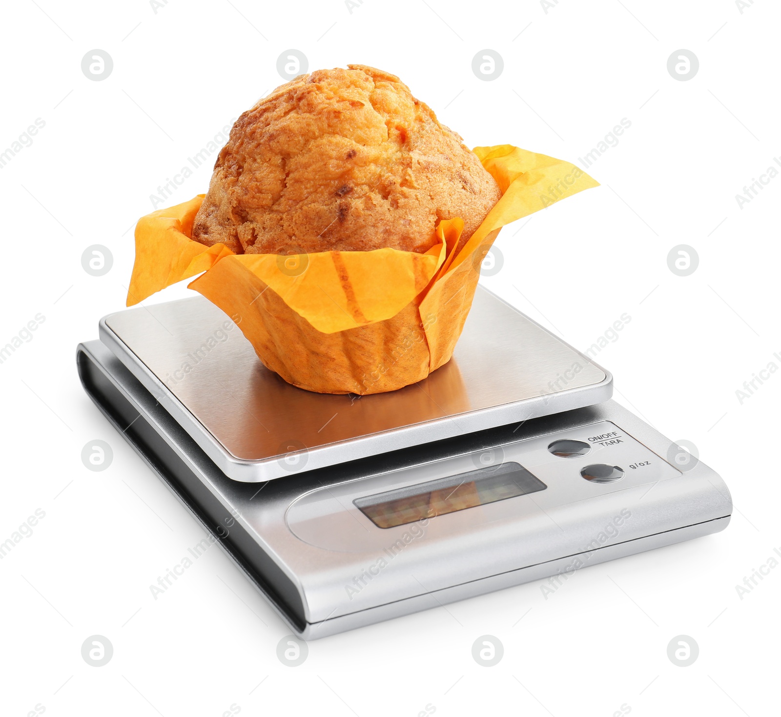 Photo of Kitchen scale with muffin isolated on white