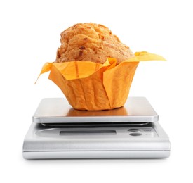 Kitchen scale with muffin isolated on white