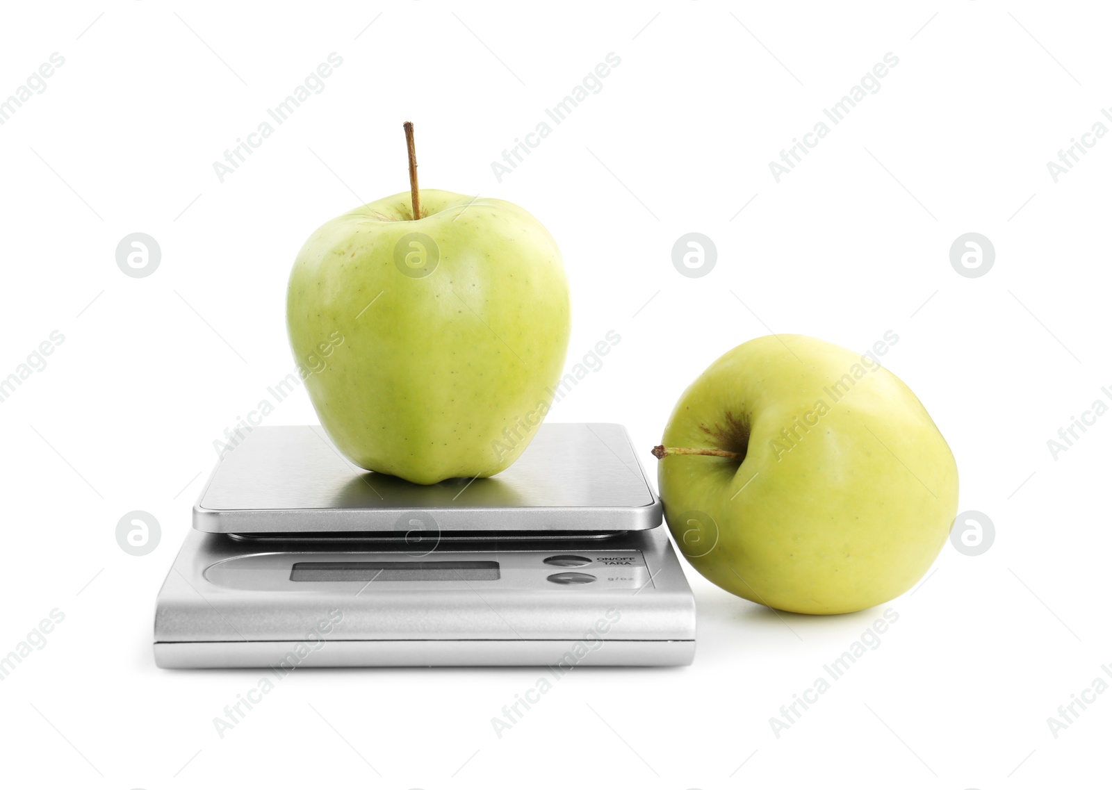 Photo of Kitchen scale with apples isolated on white