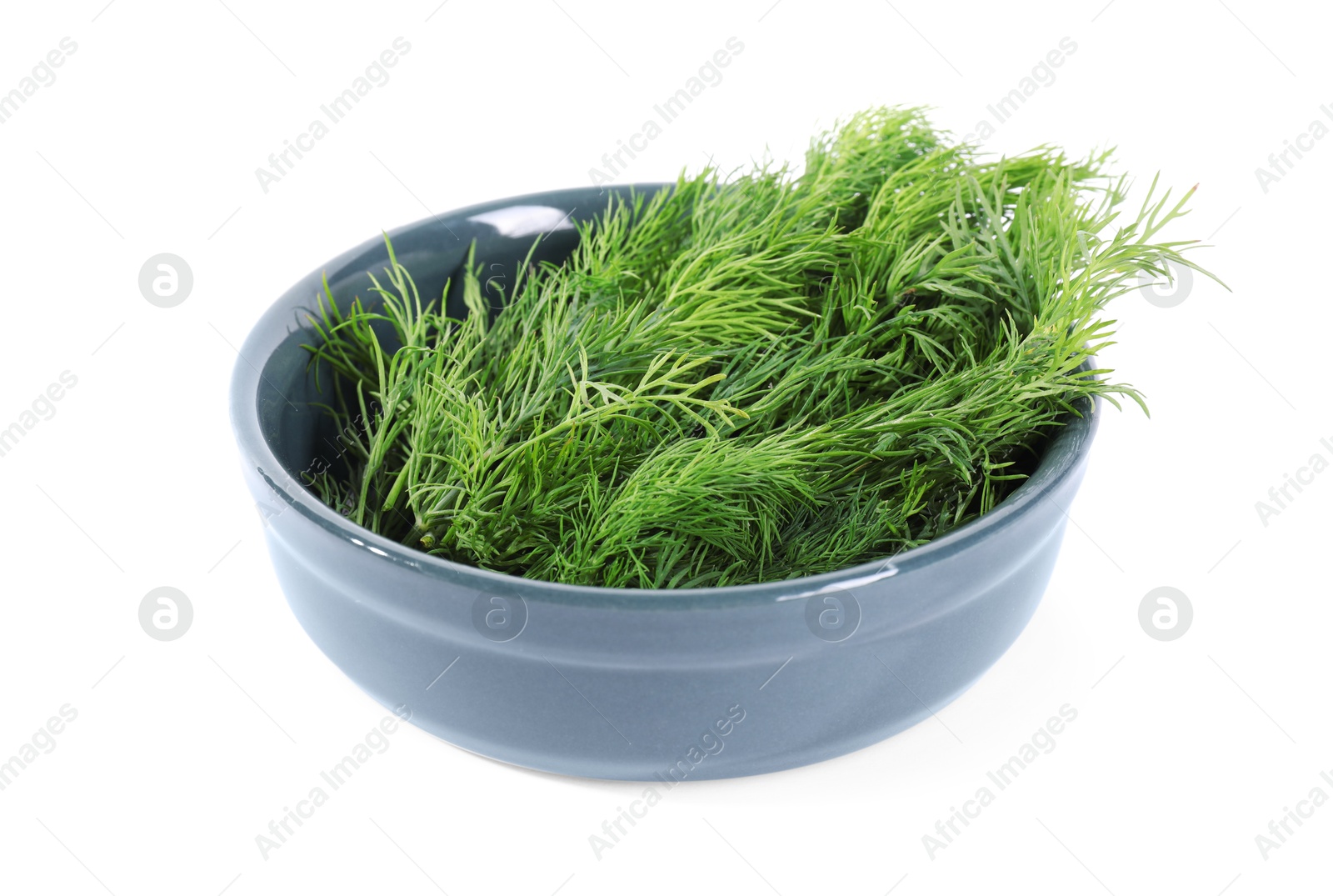 Photo of Sprigs of fresh green dill in bowl isolated on white