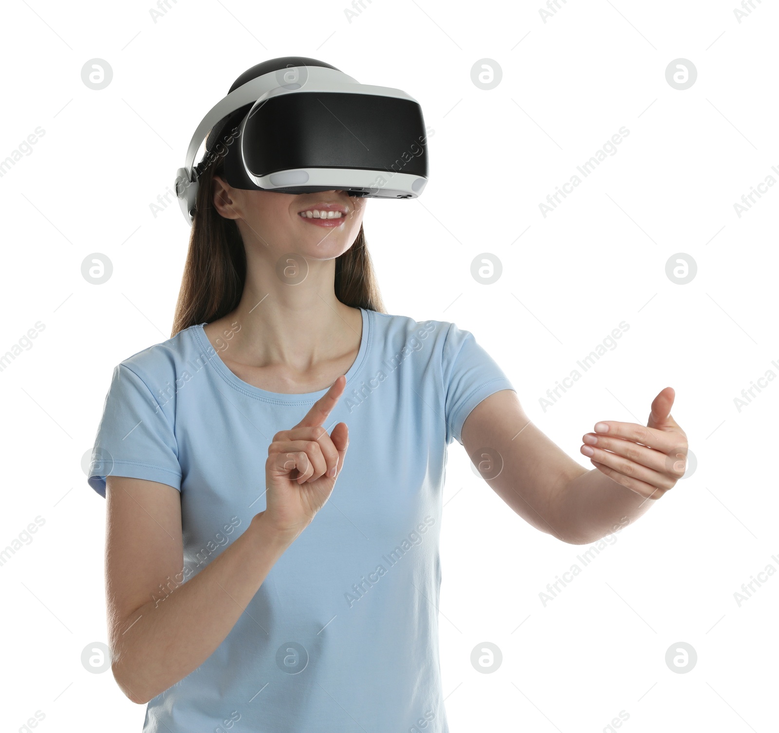 Photo of Smiling woman using virtual reality headset on white background