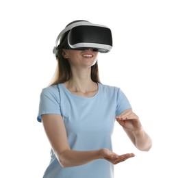 Smiling woman using virtual reality headset on white background