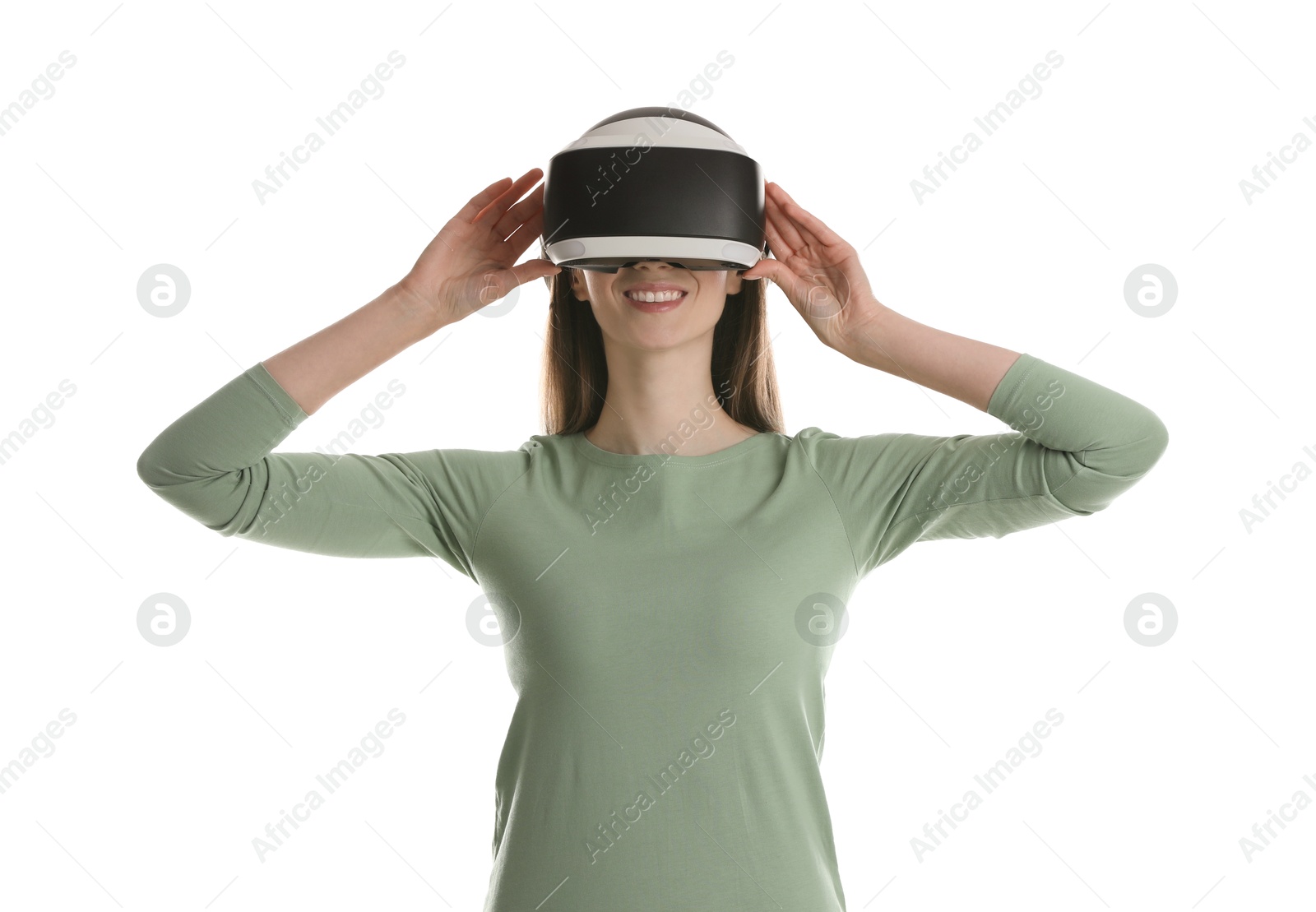 Photo of Smiling woman using virtual reality headset on white background