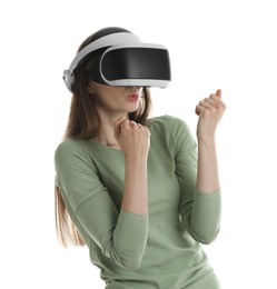 Photo of Woman using virtual reality headset on white background