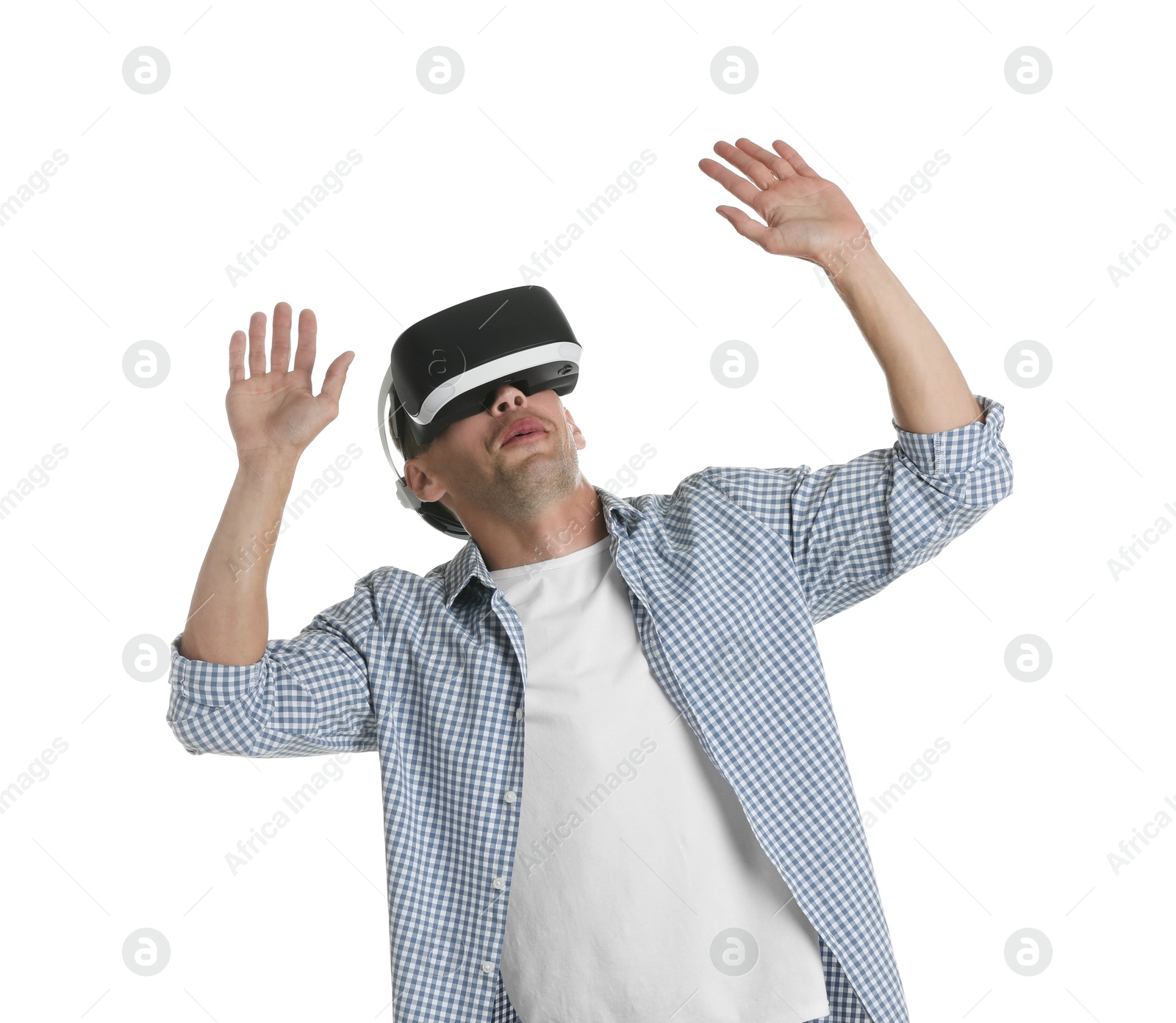 Photo of Surprised man using virtual reality headset on white background