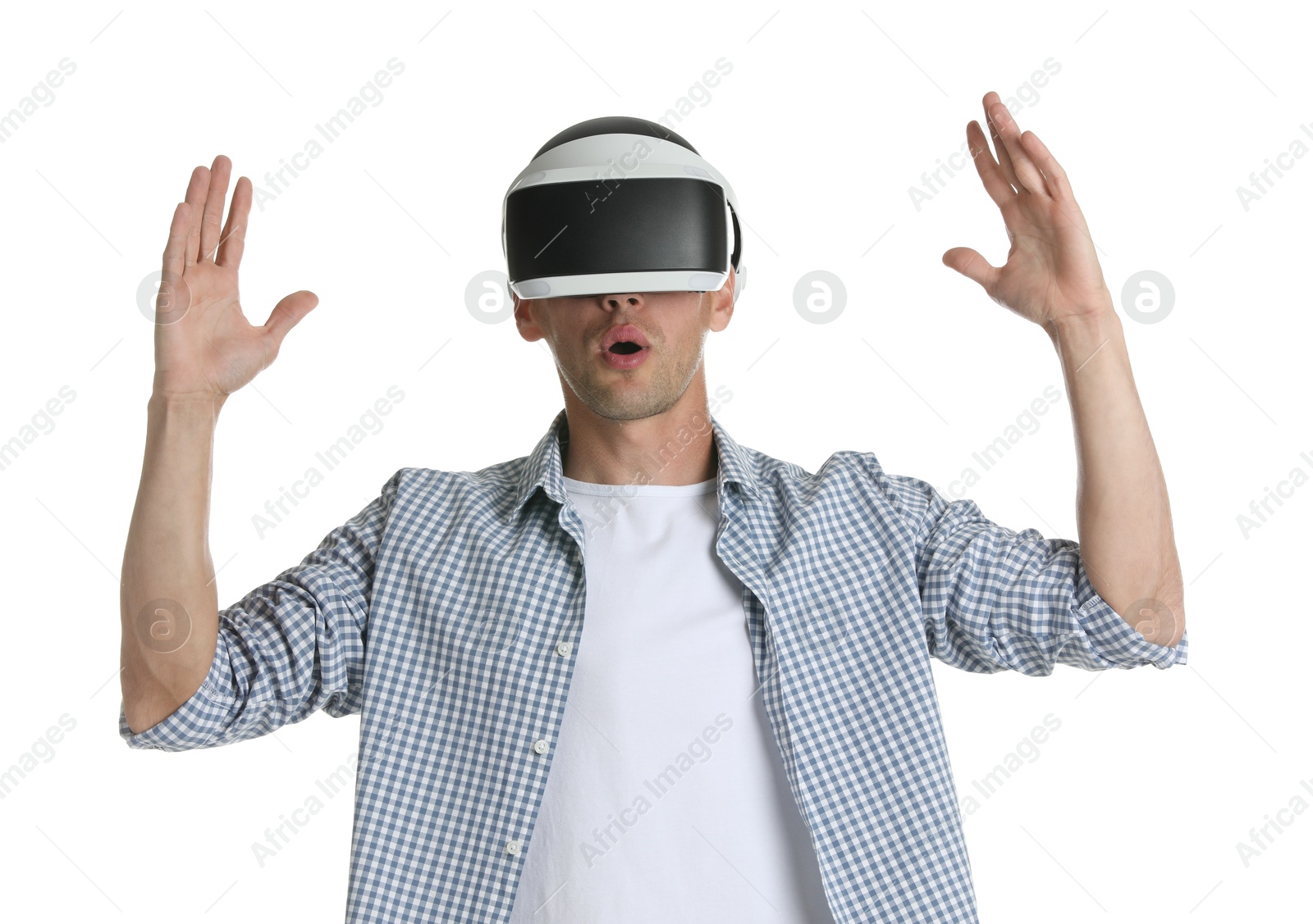 Photo of Surprised man using virtual reality headset on white background