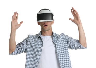 Surprised man using virtual reality headset on white background