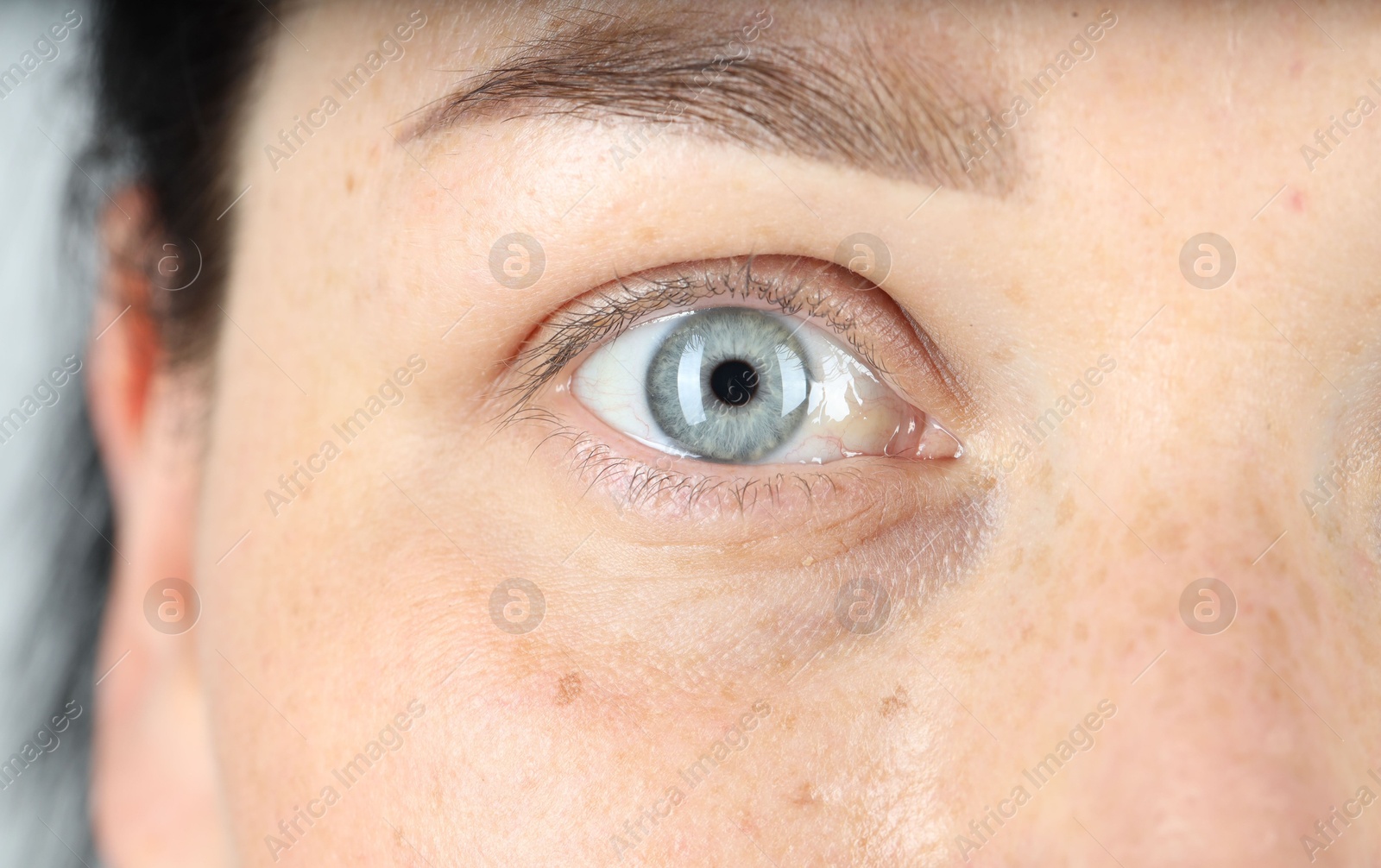 Photo of Woman with beautiful blue eyes, closeup view