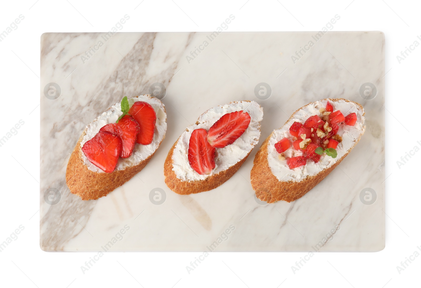 Photo of Delicious ricotta bruschettas with strawberry, mint and walnut isolated on white, top view