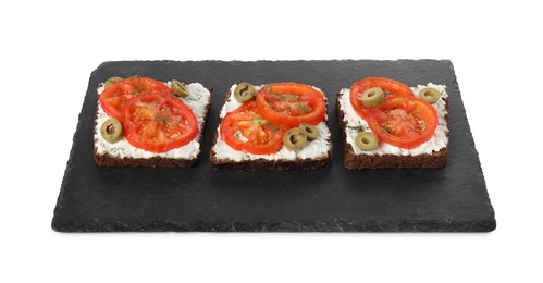 Delicious ricotta bruschettas with sliced tomatoes, olives and greens isolated on white