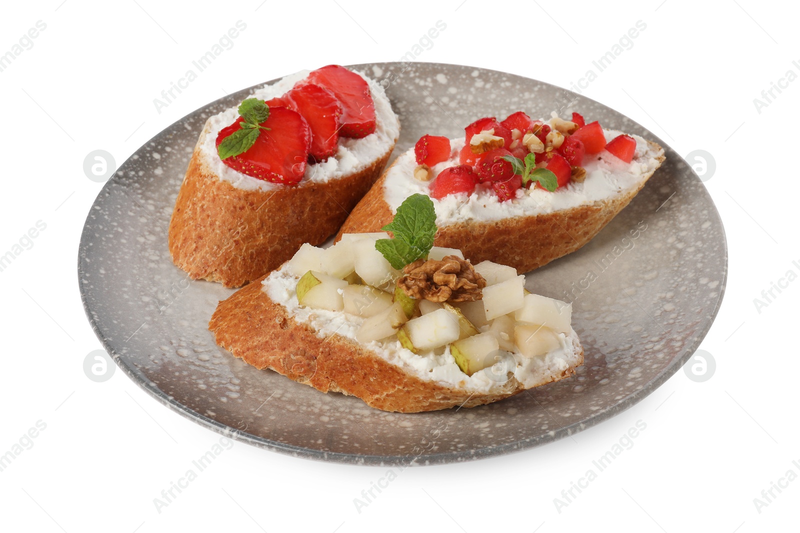 Photo of Delicious ricotta bruschettas with pear, strawberry and walnut isolated on white