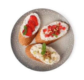 Photo of Delicious ricotta bruschettas with pear, strawberry and walnut isolated on white, top view