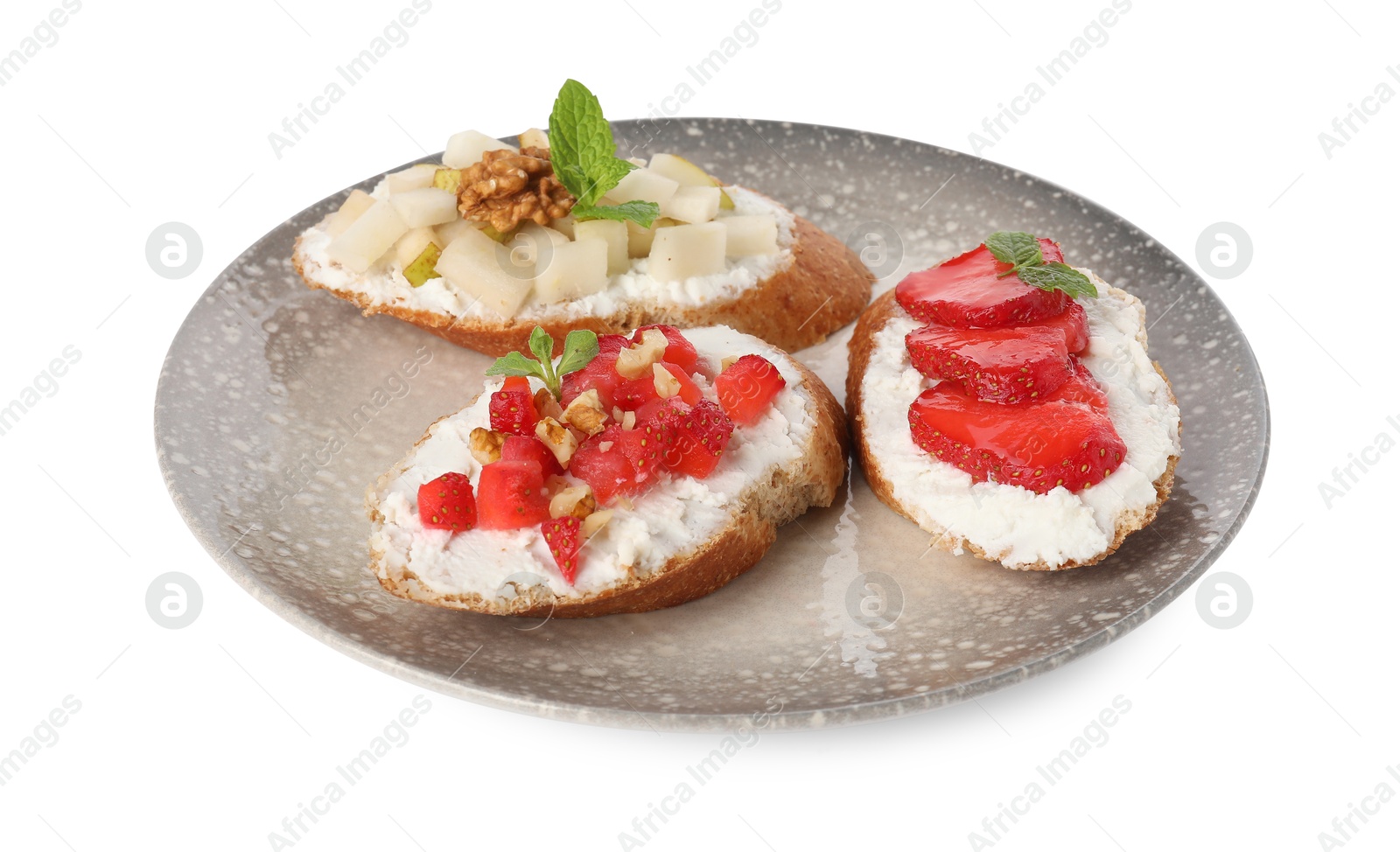 Photo of Delicious ricotta bruschettas with pear, strawberry and walnut isolated on white