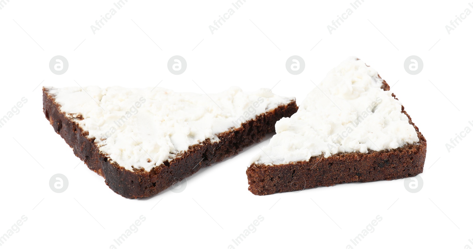 Photo of Delicious fresh ricotta (cream cheese) on pieces of bread isolated on white