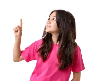 Beautiful girl pointing at something on white background