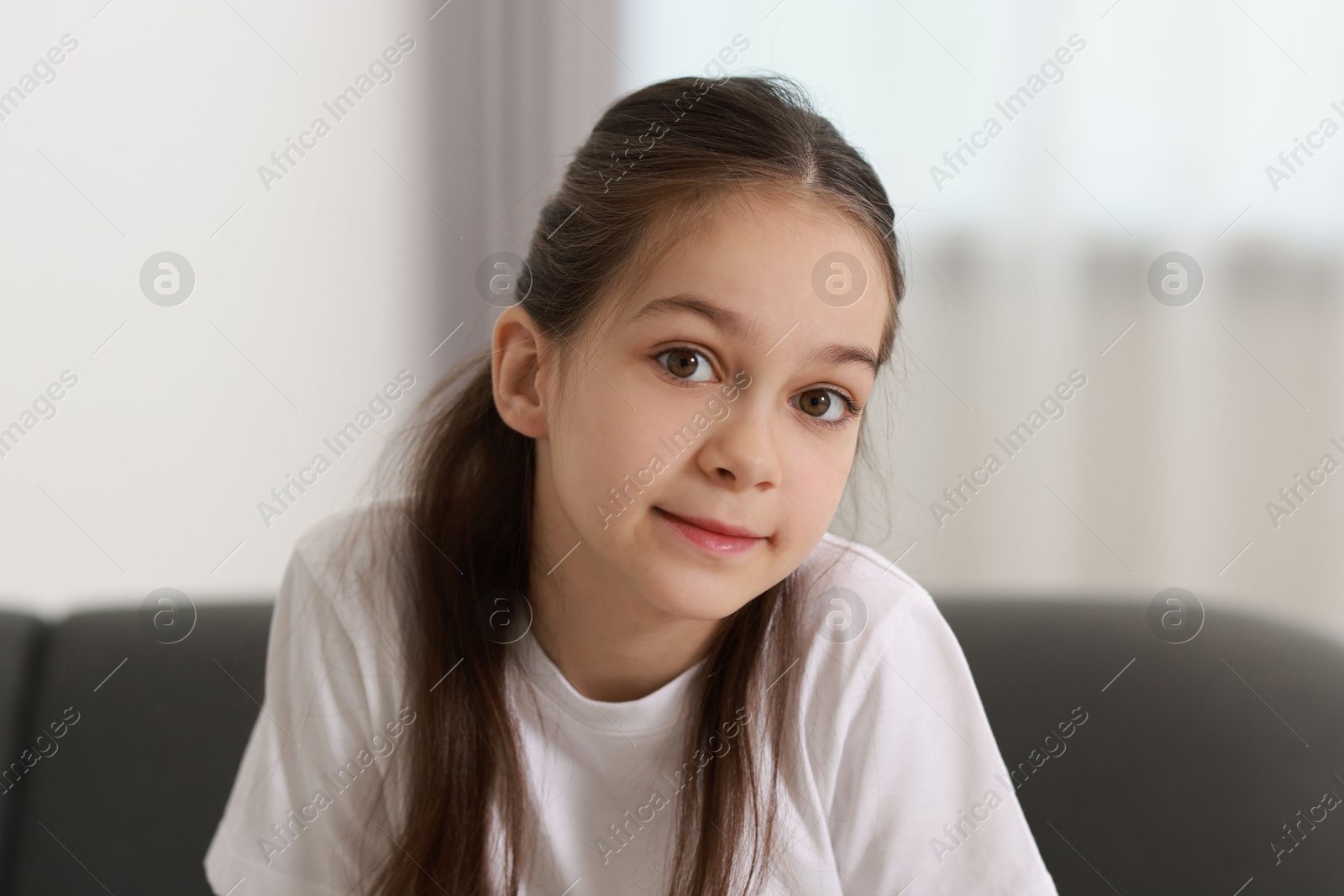 Photo of Portrait of beautiful little girl indoors. Cute child