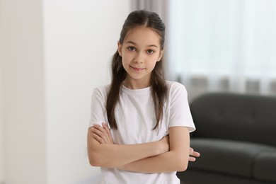 Portrait of beautiful little girl indoors. Cute child