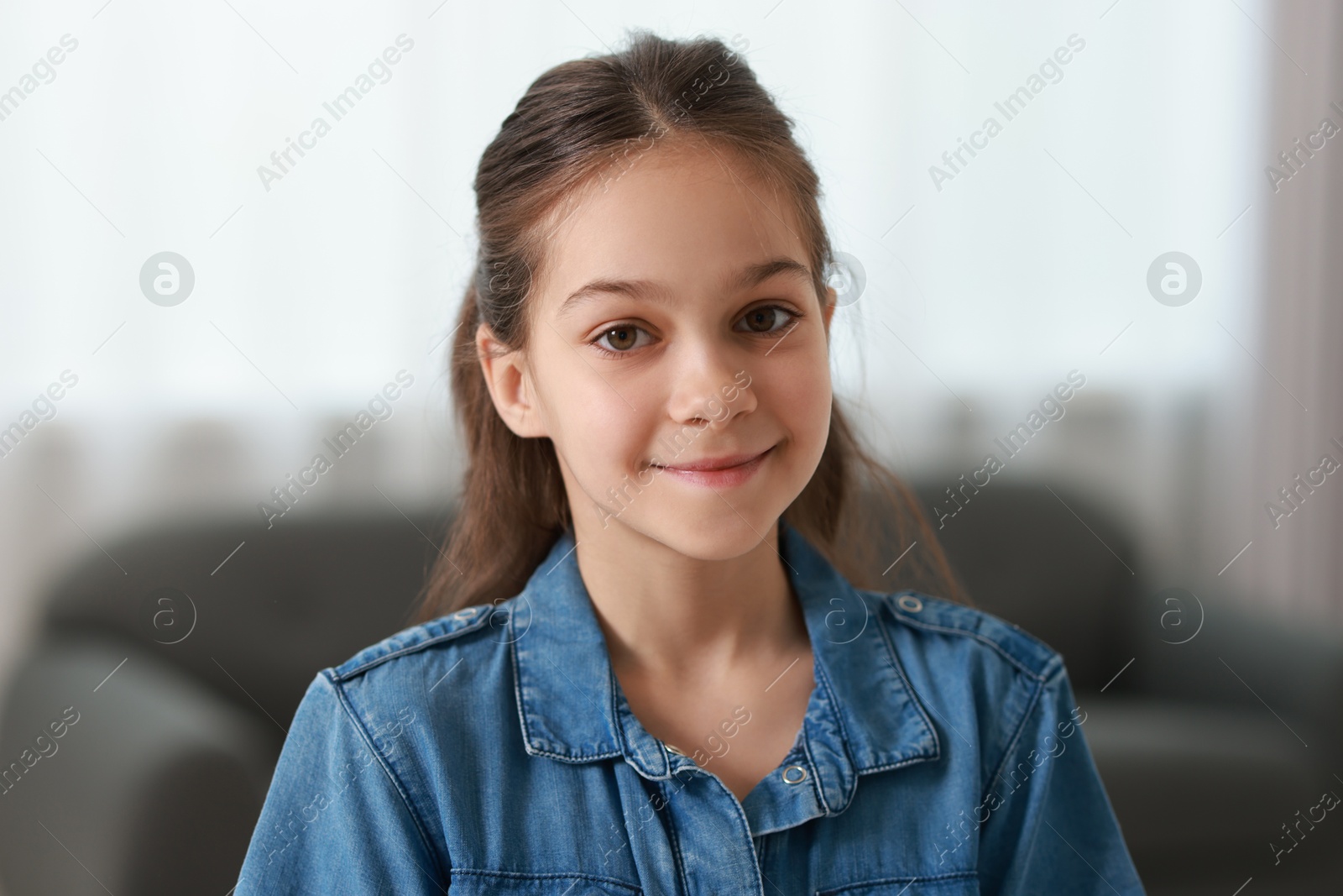 Photo of Portrait of beautiful little girl indoors. Cute child