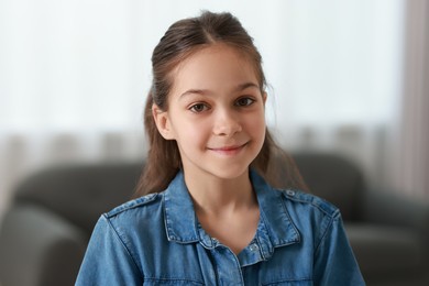 Photo of Portrait of beautiful little girl indoors. Cute child