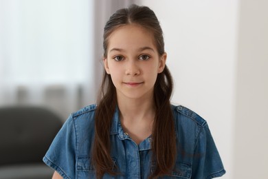 Portrait of beautiful little girl indoors. Cute child