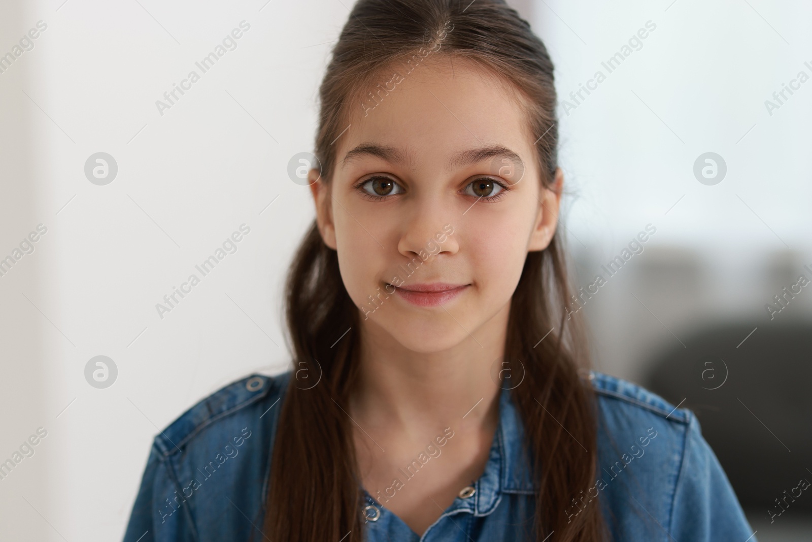 Photo of Portrait of beautiful little girl indoors. Cute child