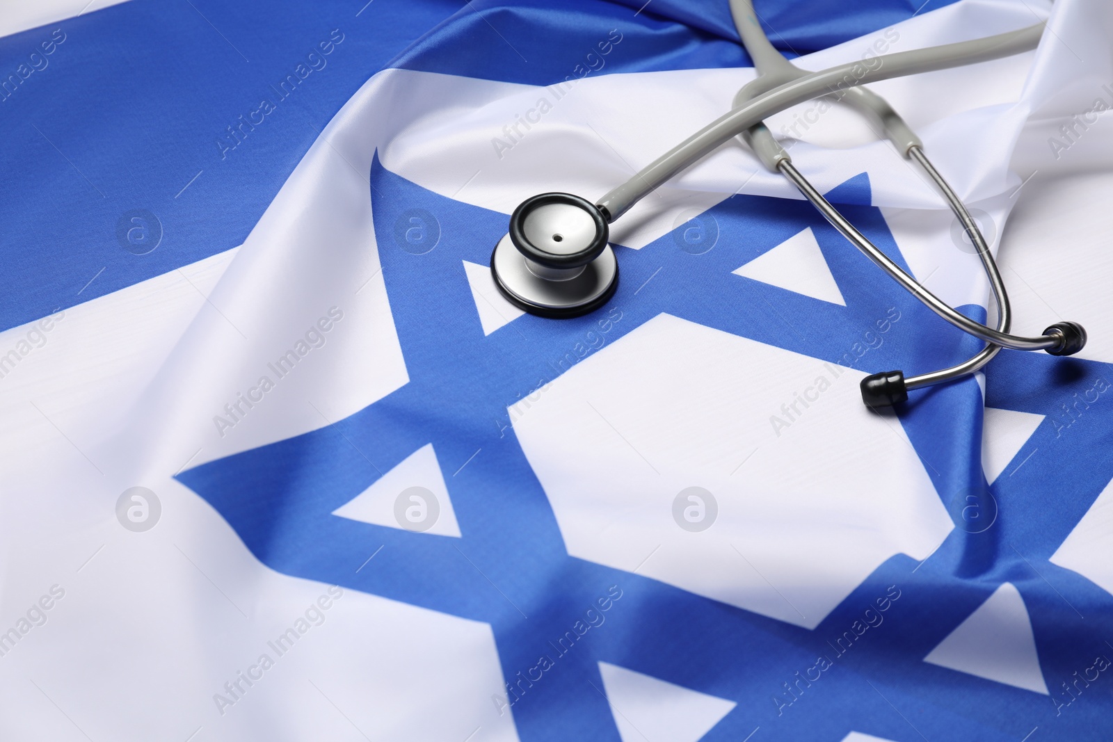 Photo of Stethoscope on flag of Israel, closeup. Health care concept