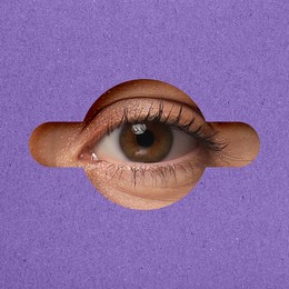 Image of Woman looking through keyhole in violet surface