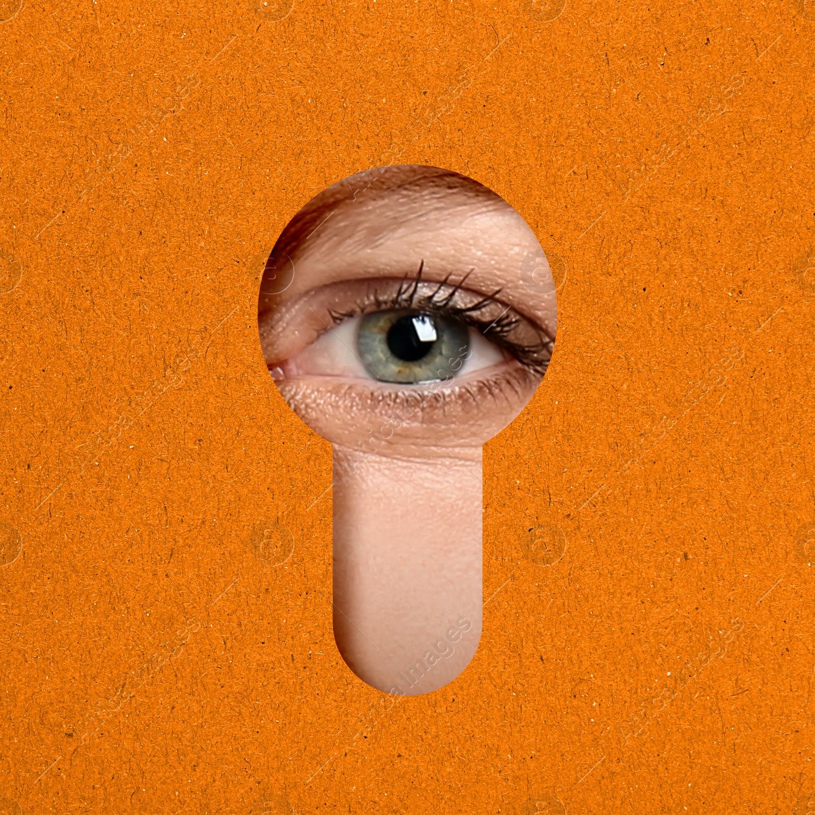 Image of Woman looking through keyhole in orange surface