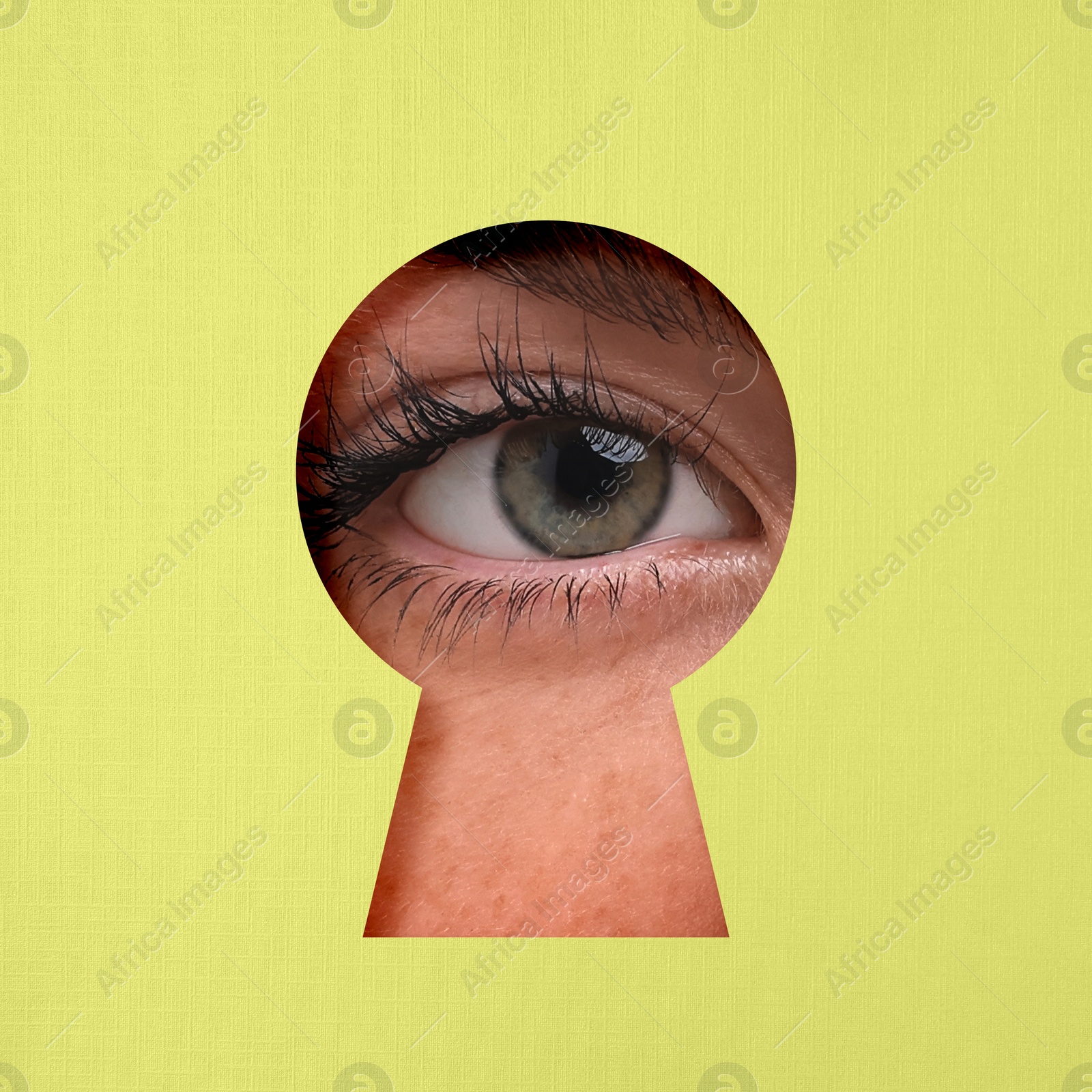 Image of Woman looking through keyhole in color surface