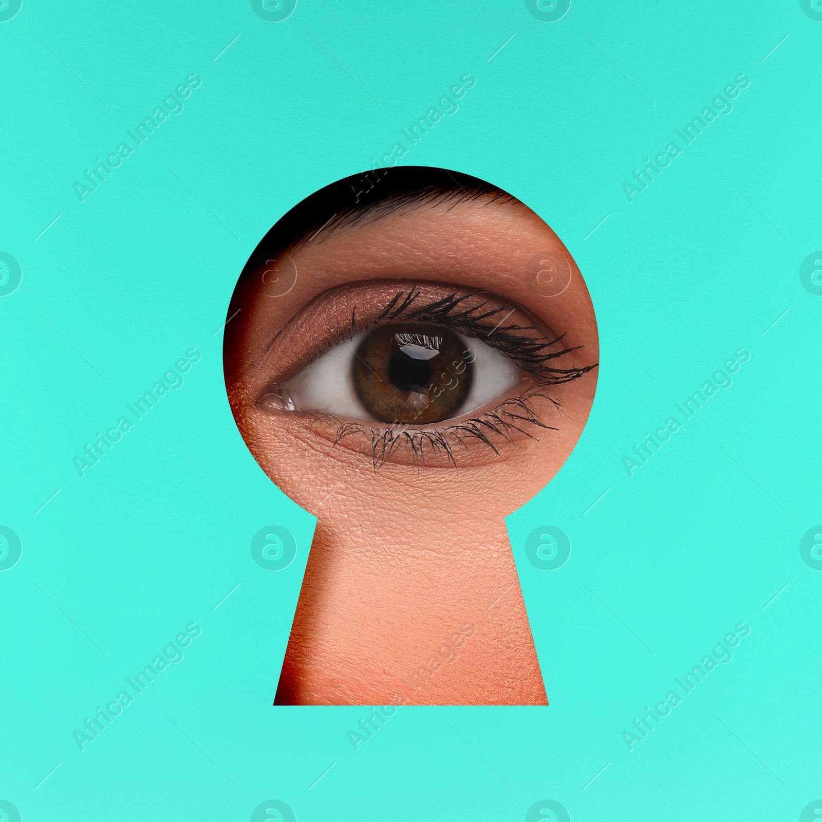 Image of Woman looking through keyhole in cyan surface