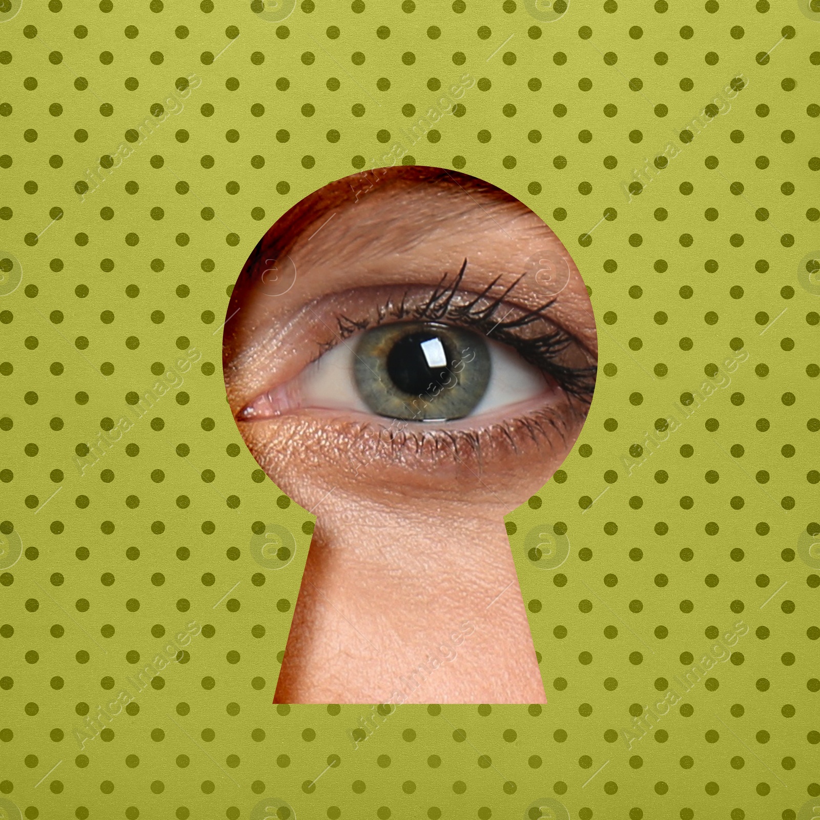 Image of Woman looking through keyhole in light green dotted surface