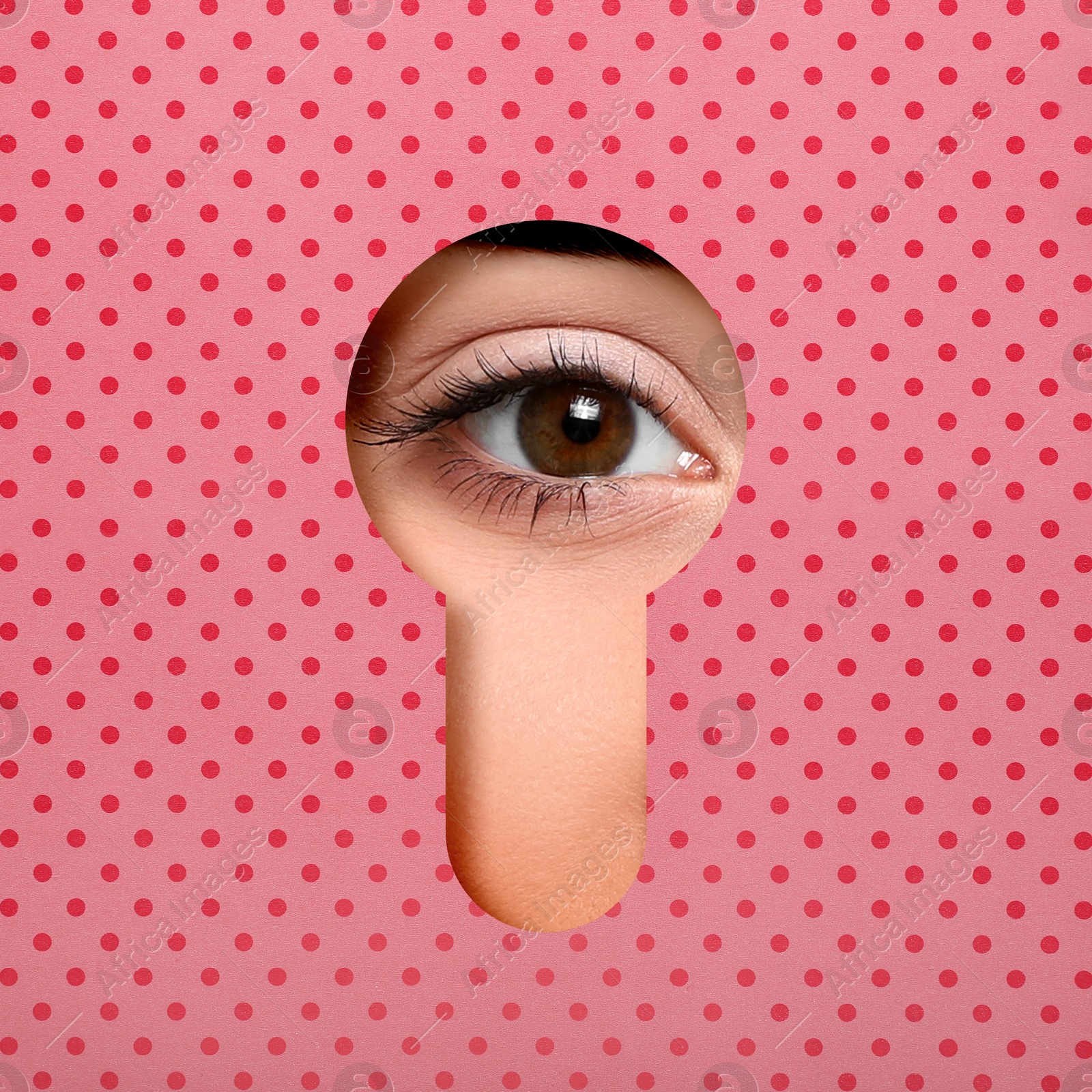 Image of Woman looking through keyhole in pink dotted surface