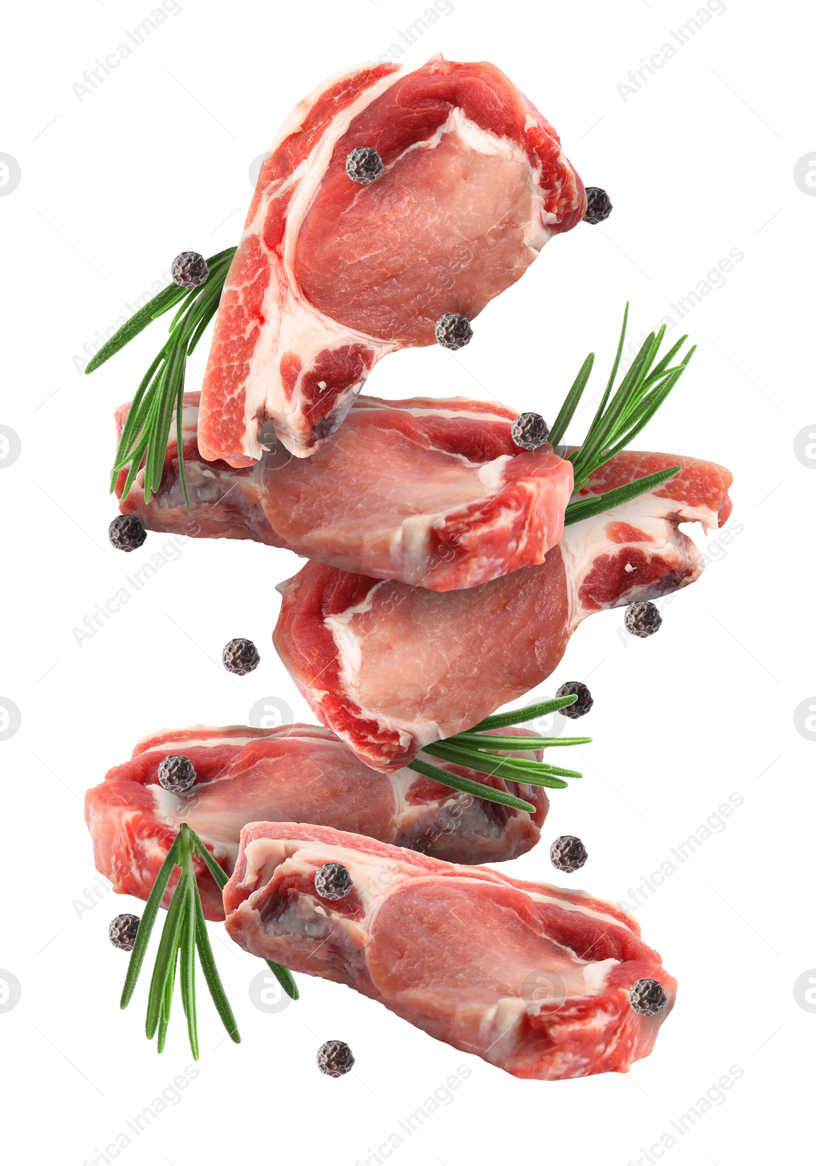 Image of Pieces of raw meat, rosemary and peppercorns in air isolated on white