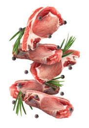 Image of Pieces of raw meat, rosemary and peppercorns in air isolated on white