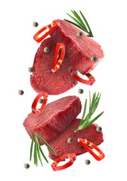 Image of Pieces of raw beef meat, pepper slices, rosemary and peppercorns in air isolated on white