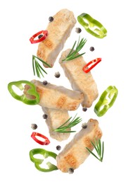 Image of Pieces of grilled chicken meat, pepper slices, rosemary and peppercorns in air isolated on white