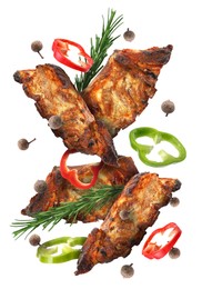 Image of Grilled beef ribs, pepper slices, rosemary and peppercorns in air isolated on white