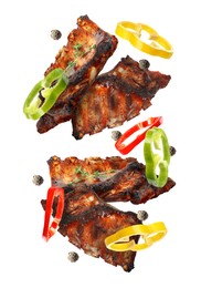 Image of Grilled beef ribs, pepper slices and peppercorns in air isolated on white