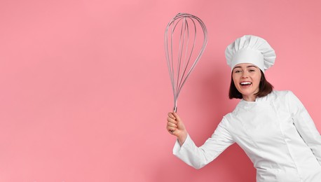 Happy pastry chef with big whisk on pink background. Banner design