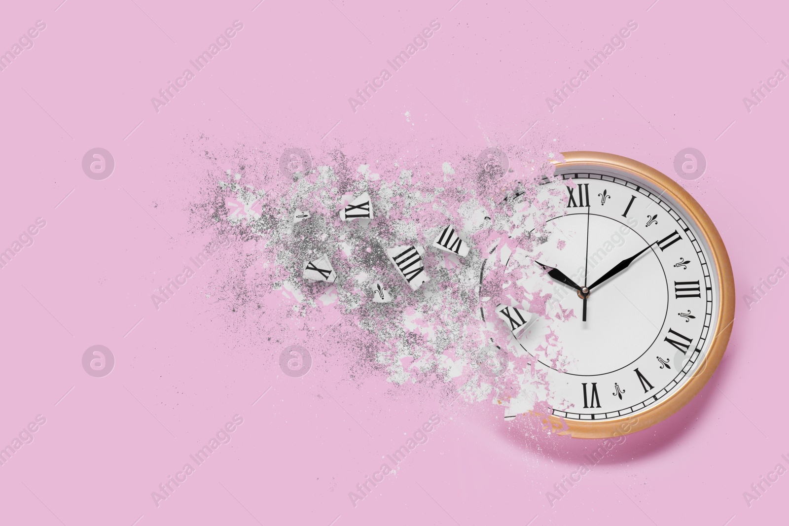 Image of Clock shattering into pieces on pink background. Flow of time