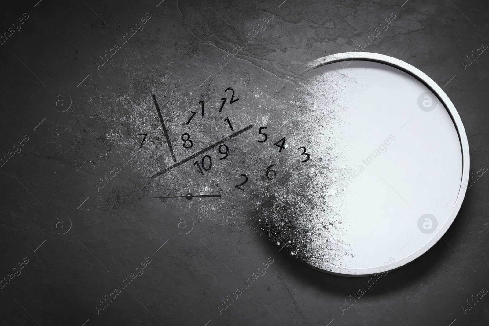 Image of Analog clock dissolving on dark background. Time is running out