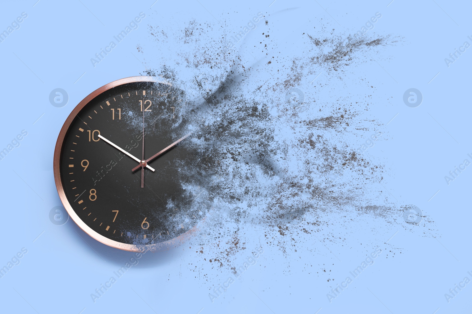 Image of Analog clock dissolving on light blue background. Time is running out