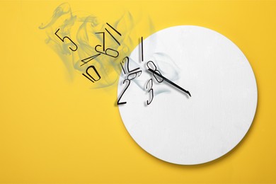 Image of Numerals and hands flying away from clock on yellow background. Time is running out