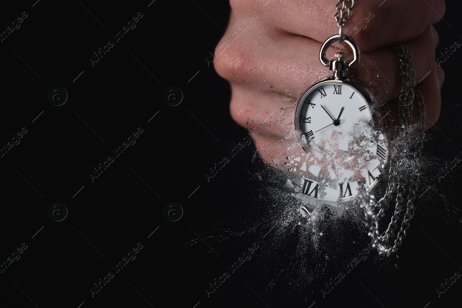 Image of Businessman holding dissolving chronometer on black background, closeup. Time is running out