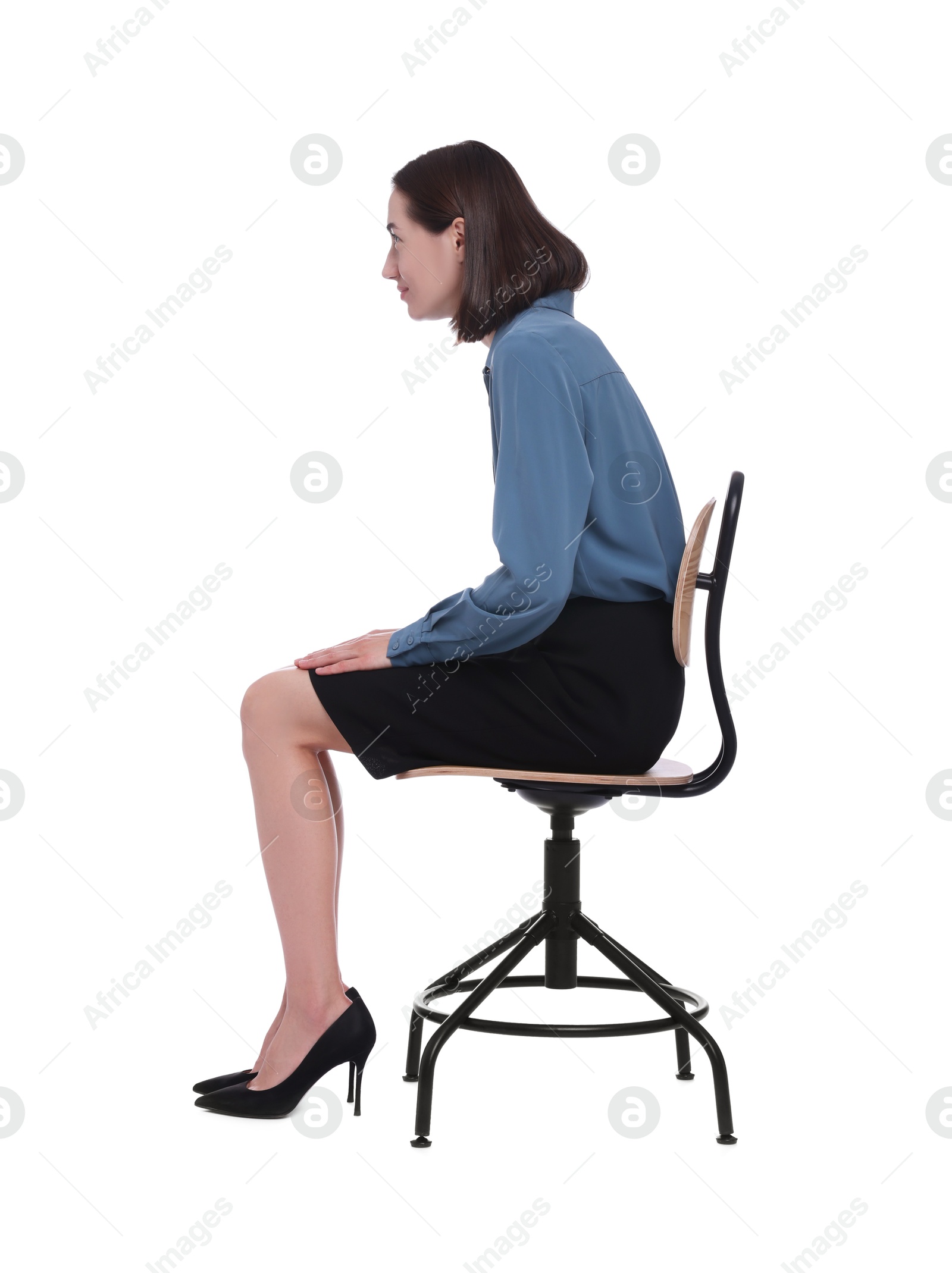 Photo of Woman with poor posture sitting on chair against white background