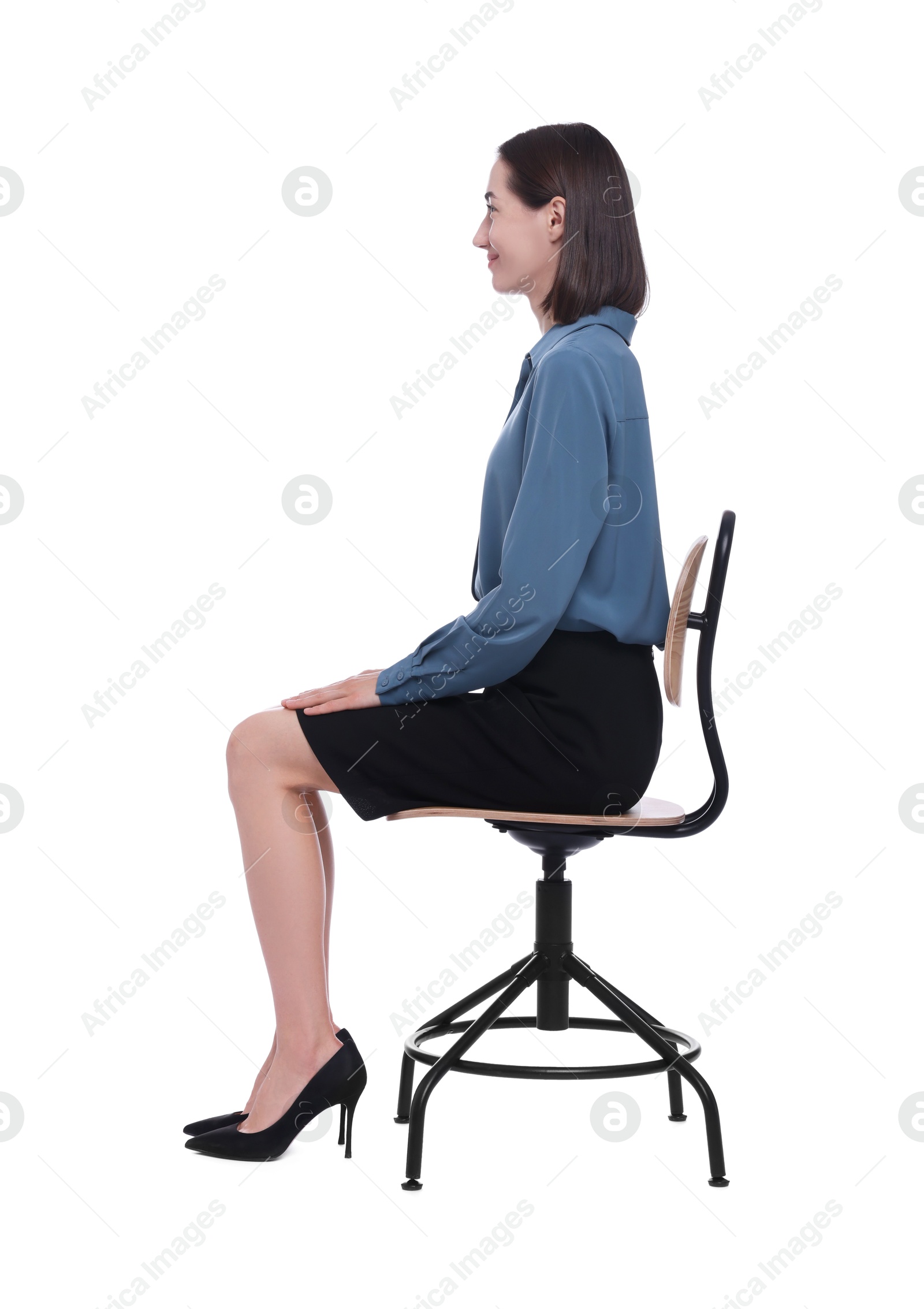 Photo of Woman with good posture sitting on chair against white background