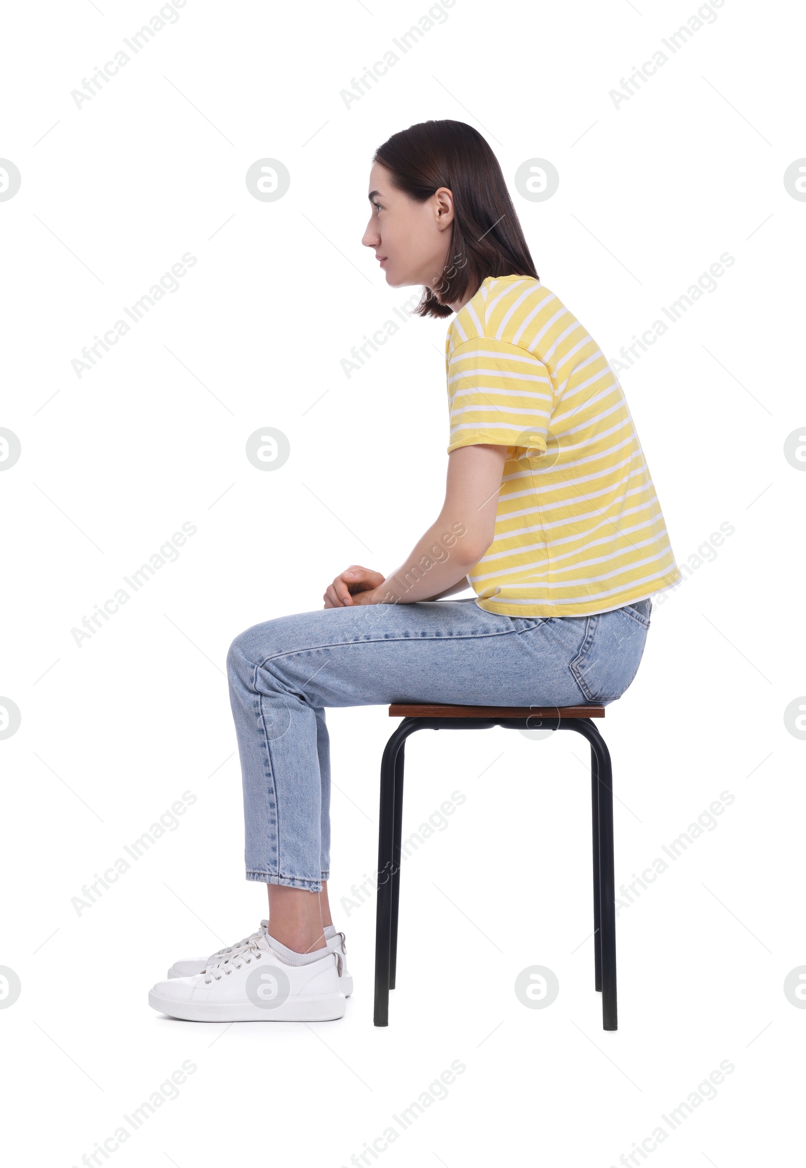 Photo of Woman with poor posture sitting on chair against white background