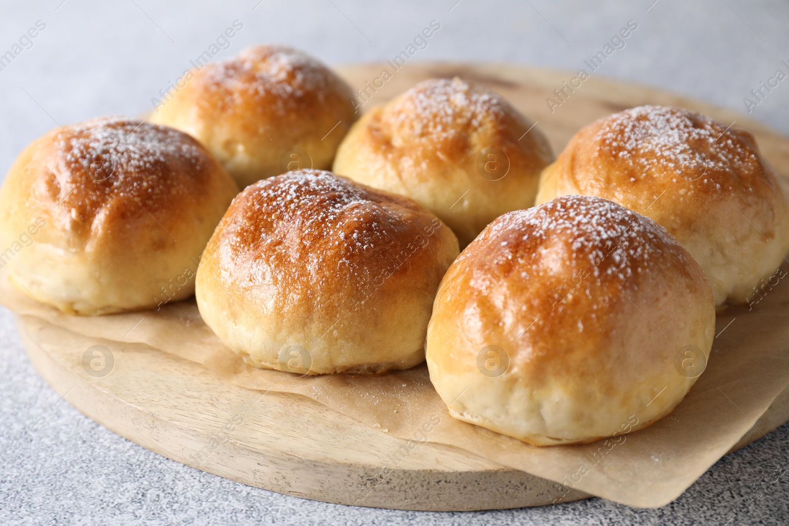 Photo of Delicious dough balls on grey table, closeup