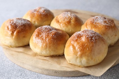 Photo of Delicious dough balls on grey table, closeup