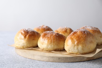 Photo of Delicious dough balls on grey table, closeup